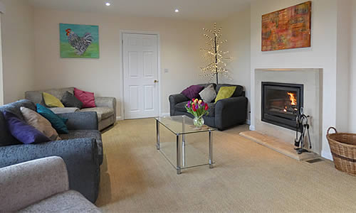 Spacious lounge and woodburner stove